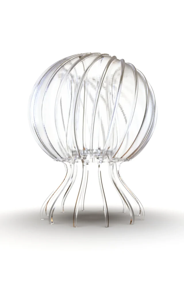 La Méduse table lamp by IDEA34: a clear, ribbed translucent dome resting on slender curved legs that fall like jellyfish tentacles.